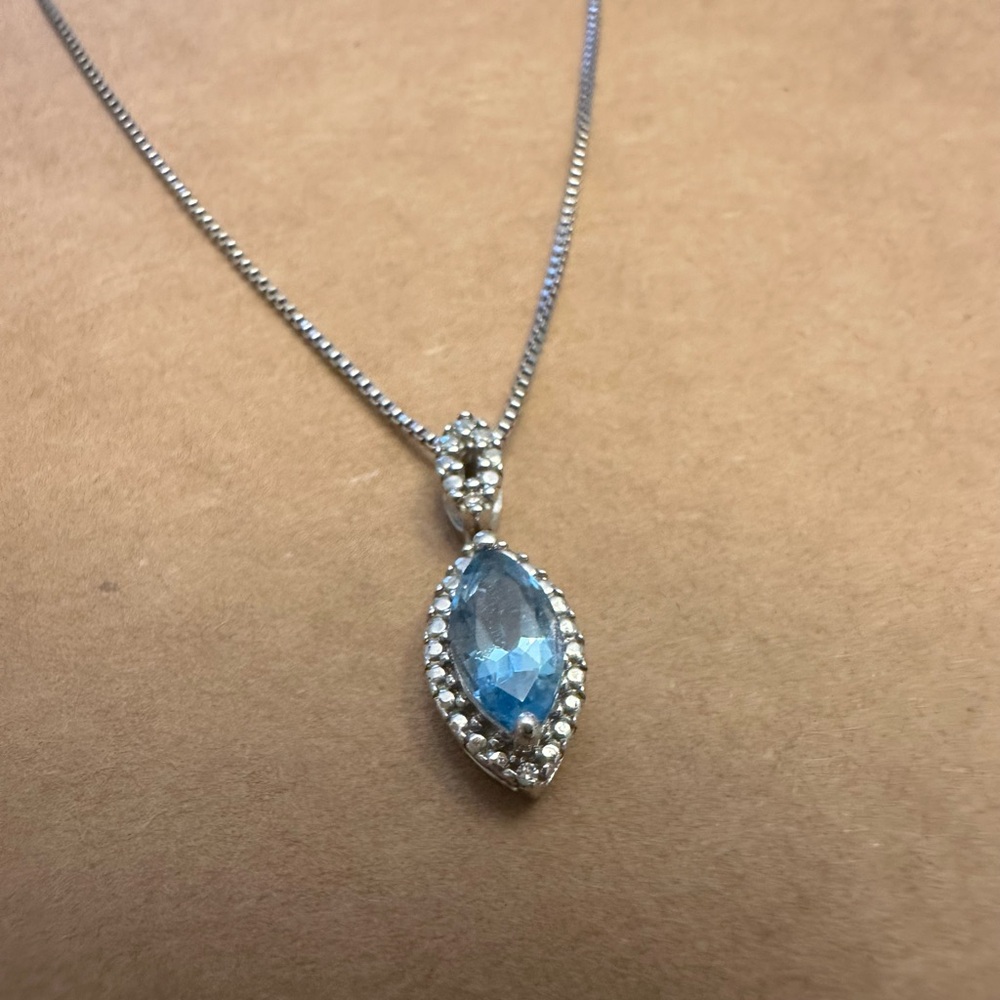 Beautiful Sterling silver necklace with a Blue Topaz pendant.